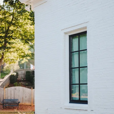 a white house with a black window