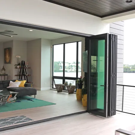 Balcony opens to living room with open accordion style door from Euro-Wall