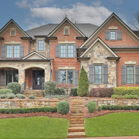 Beautiful brick house with bronze casement windows and narrow frames for bigger views.