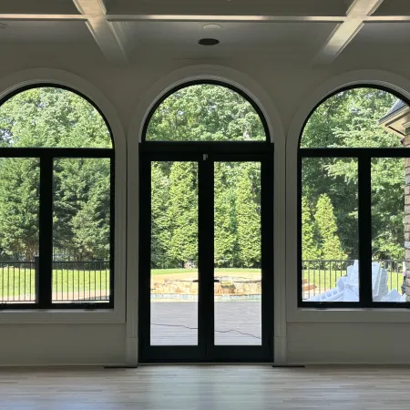 Elegant arched bronze picture windows 