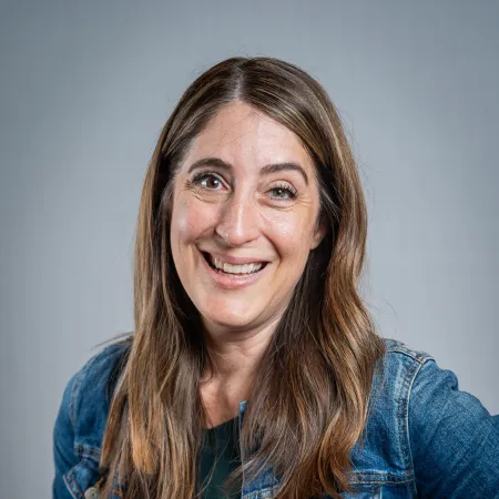 a woman with long hair smiling