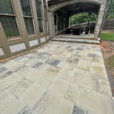 a stone patio with a stone walkway