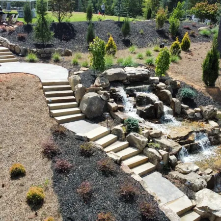 a small garden with a small waterfall