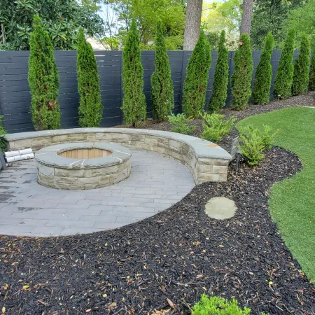 a stone fountain in a garden