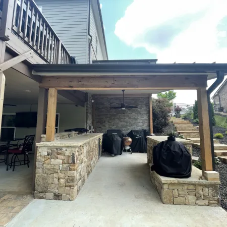 a patio with a fireplace and a dog in it