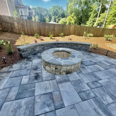 a small garden with a stone circle