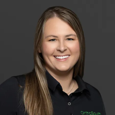 a woman smiling for the camera