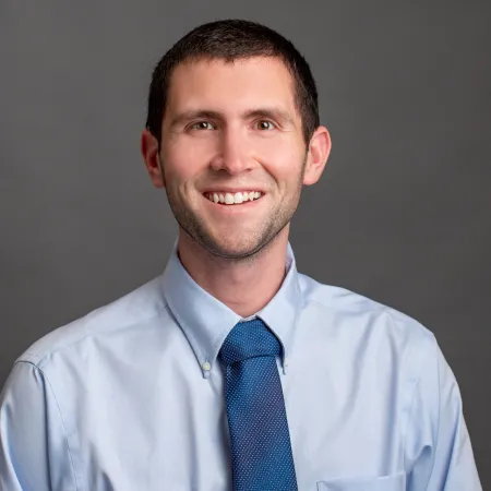 a man wearing a blue tie