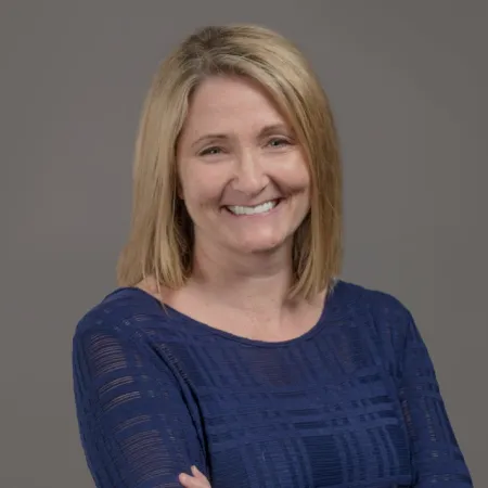 a woman with her arms crossed