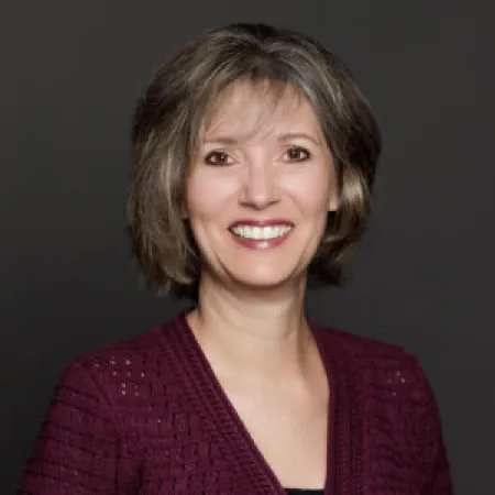 a woman smiling for the camera