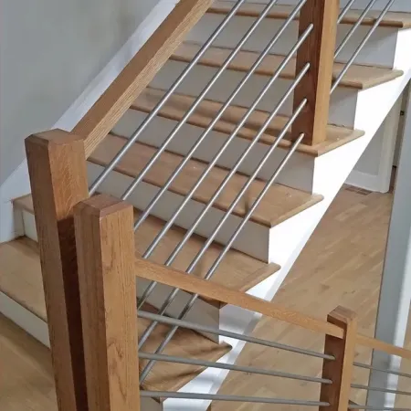 Modern staircase with wooden steps and railing combined with horizontal metal bars for a sleek look