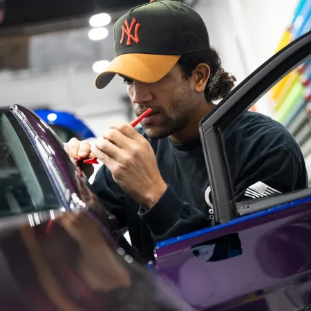 a man in a car smoking a cigarette