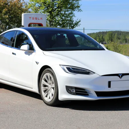 a white car parked on the side of the road