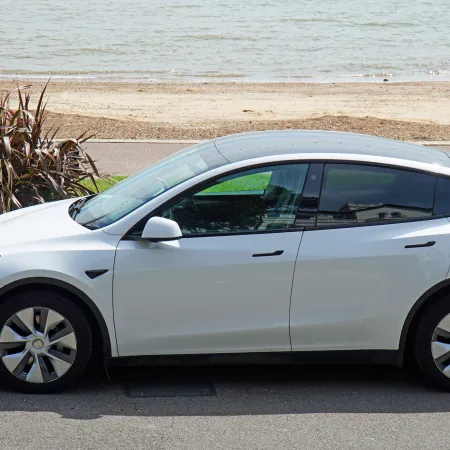 a white car parked on the side of a road