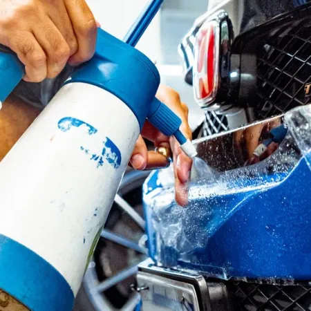 a person working on a car engine