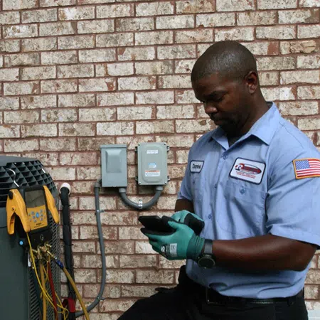 a person wearing a blue shirt and gloves holding a camera