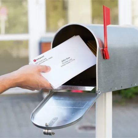 mail being put into a mailbox