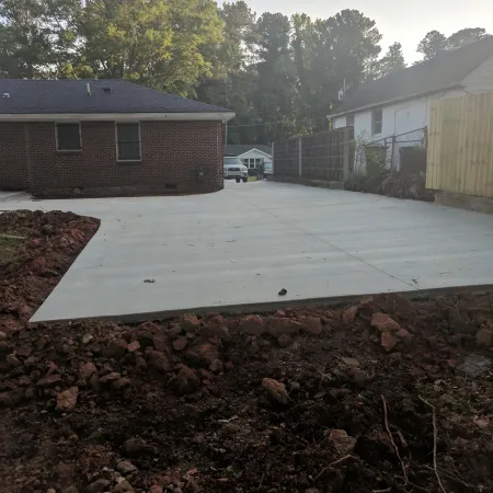 a driveway with a pile of leaves