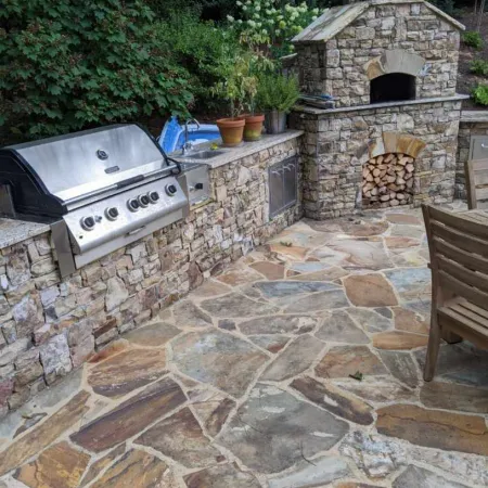 a stone patio with a stone oven