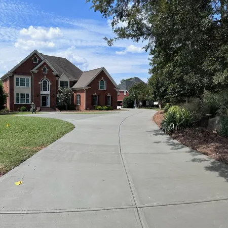 a sidewalk with houses on the side