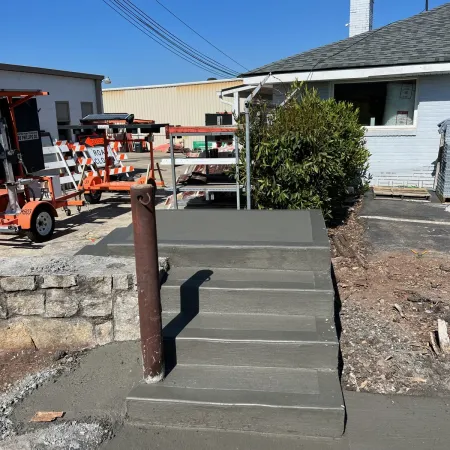 a cement staircase leading up to a house