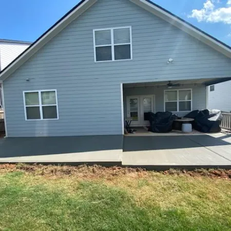 Stamped concrete with wood plank look adding classic charm to the home