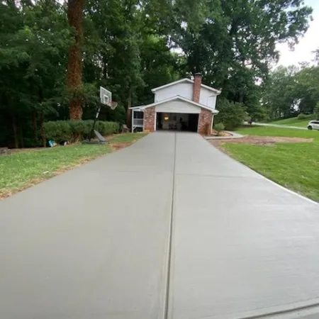 a concrete ramp leading to a house