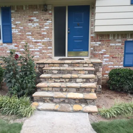 a brick house with blue doors