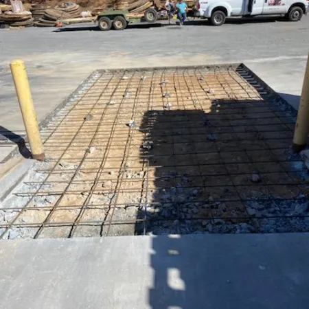 a brick walkway with a truck parked on the side