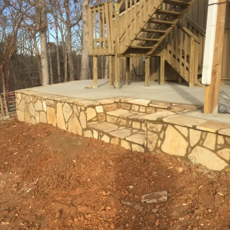 a stone wall with a staircase