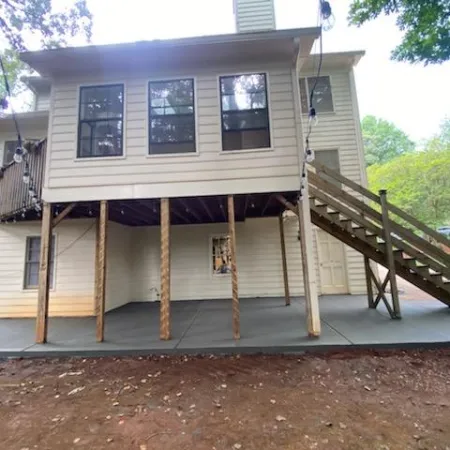Patio slab poured under the existing house structure