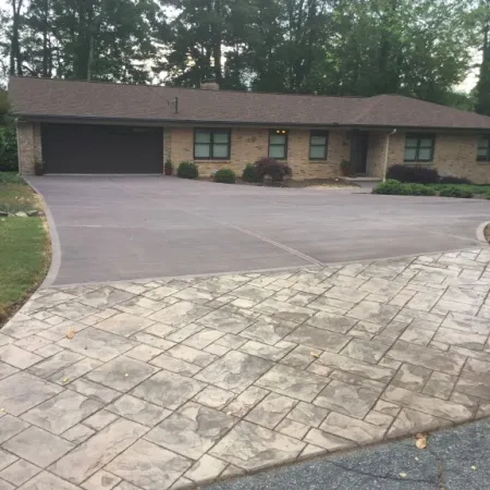 a building with a brick driveway