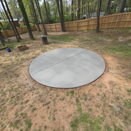 Circular concrete pad designed as a functional backyard dining space