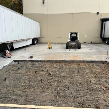 a group of people working on a concrete floor