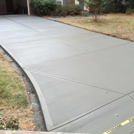 a sidewalk with a concrete walkway