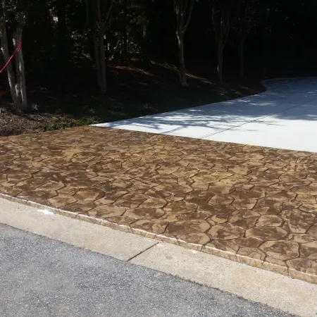 Stamped concrete driveway apron with elegant entry design