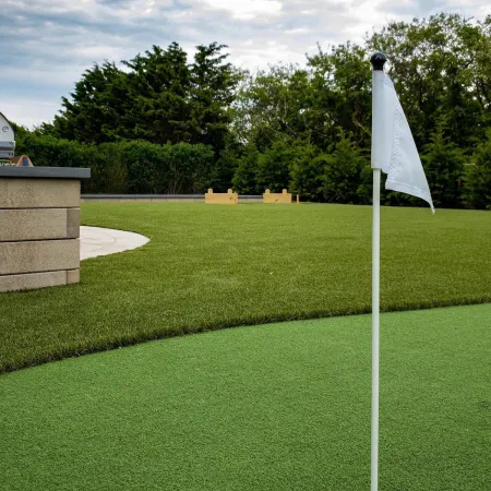 a golf ball on a green grass field