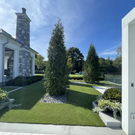 a building with a lawn and trees