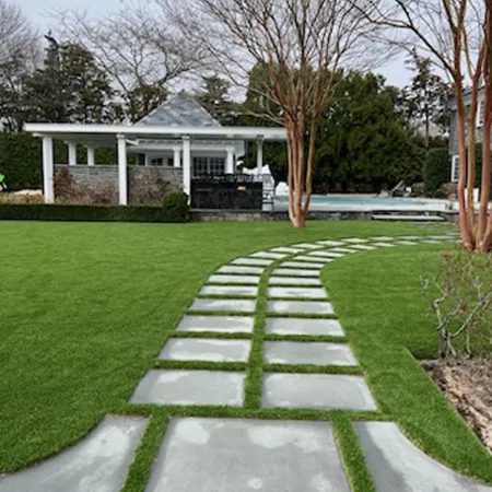 a green lawn in front of a house