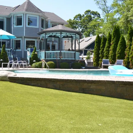 a swimming pool in front of a house