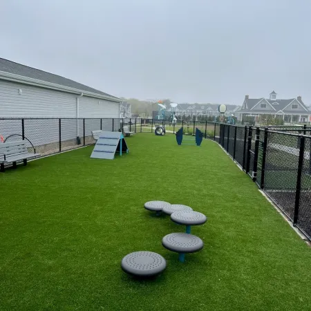 a group of benches in a grassy area
