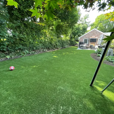 a backyard with a swing set