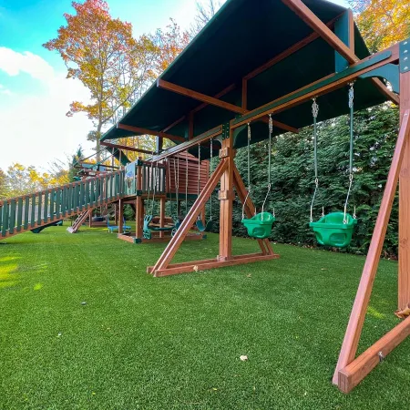 a small play set in a yard