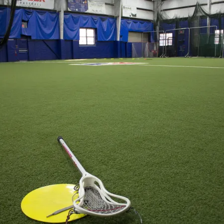 a tennis racket and a ball on a court