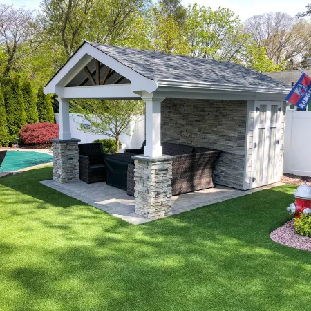 a small building with a small pond