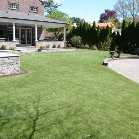 a large green lawn in front of a house