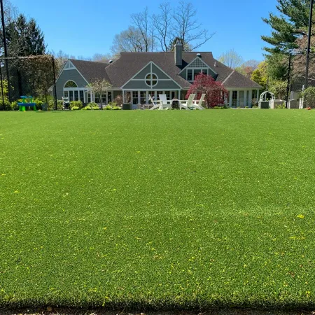 a large green lawn in front of a house