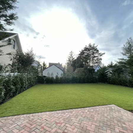 a brick path leading to a house