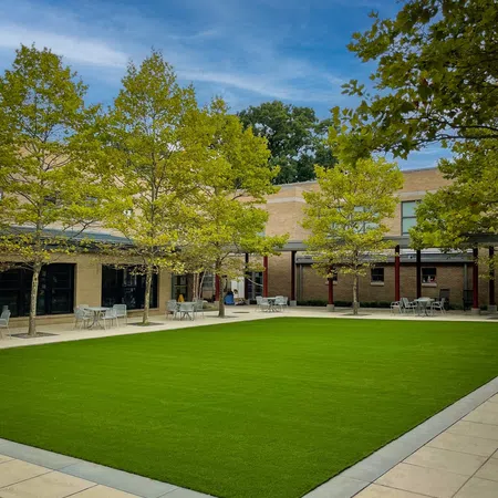 a building with trees in front