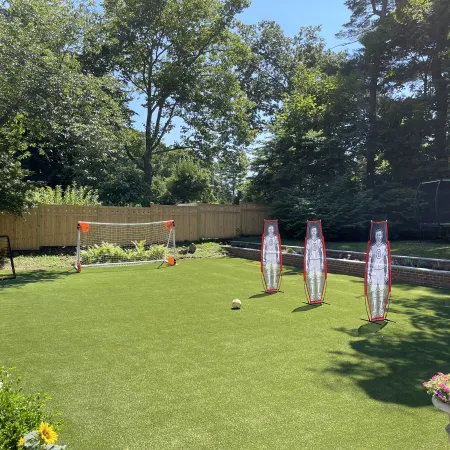 a backyard with a goal and a football goal